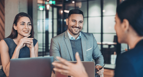 Professionals in office setting - discussing compliance trends August 2024