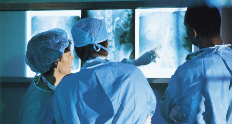 Doctors examining x-ray - concept for Regulation (EU) 20241860 Article 10a