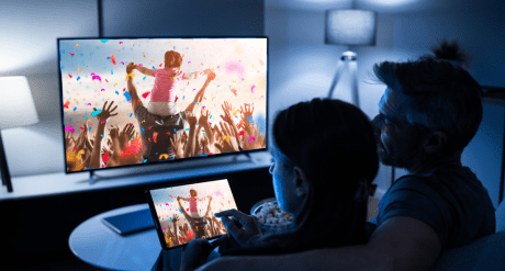 Couple watching tv - concept for energy efficiency - Star Rating Table for Colored Televisions