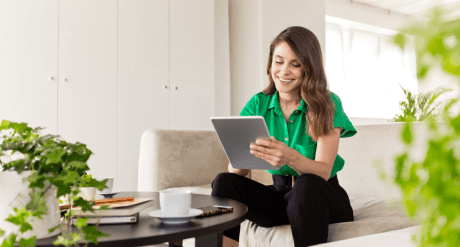 Woman on tablet working in eco-friendly office - concept for Ecodesign for Sustainable Products Regulation (ESPR)